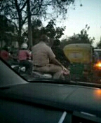 police uncle without helmet.